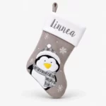 Pingviini-aiheinen harmaa joulusukka